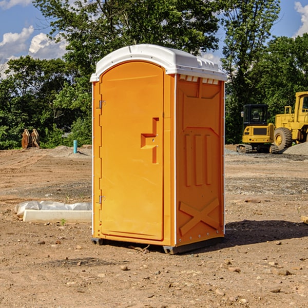 how often are the portable restrooms cleaned and serviced during a rental period in Canadian Lakes MI